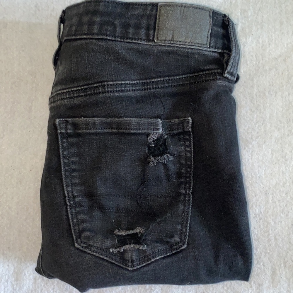Really destroyed black American Eagle jeans
